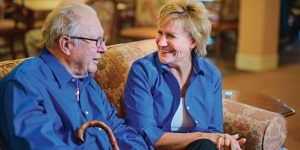 Caregiver chats with senior client